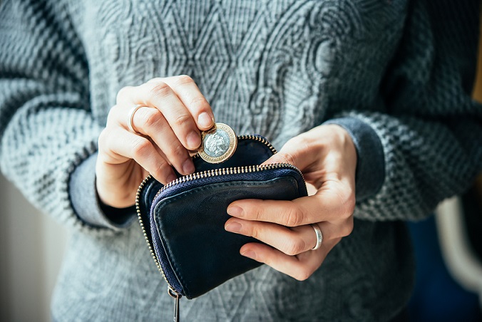 woman with purse saving money